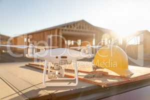 Drone Quadcopter Next to Hard Hat Helmet At Construction Site