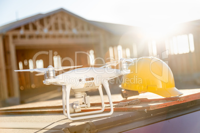 Drone Quadcopter Next to Hard Hat Helmet At Construction Site