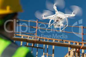 Female Pilot Flies Drone Quadcopter Inspecting Construction Site
