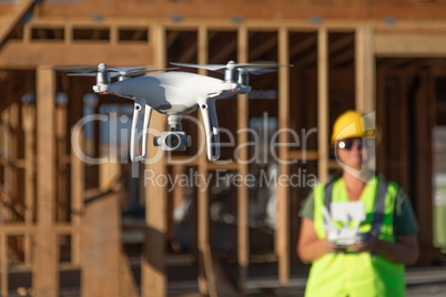 Female Pilot Flies Drone Quadcopter Inspecting Construction Site