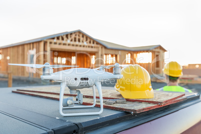 Drone Quadcopter Next to Hard Hat Helmet At Construction Site wi
