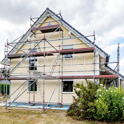 Single-family house with scaffolding