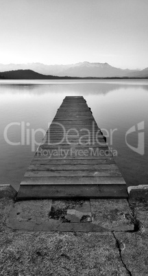 black and white pier on the lake