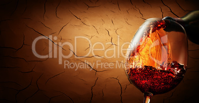 Wine on cracked clay background