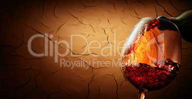 Wine on cracked clay background