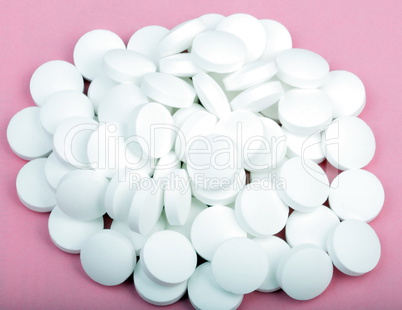 white pill on pink background