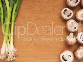Organic spring onions with mushrooms
