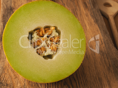 Organic galia melon on wooden table