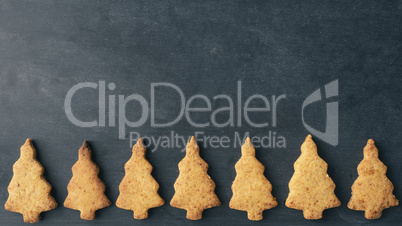 Tasty Christmas cookies on chalkboard