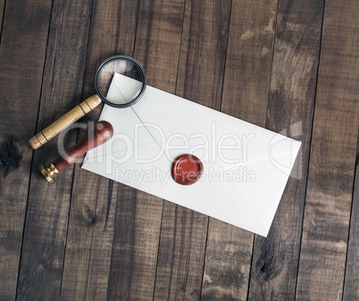 Envelope, stamp, magnifier