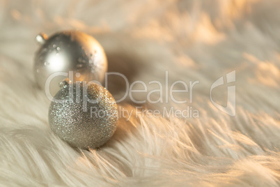 two silver Christmas balls