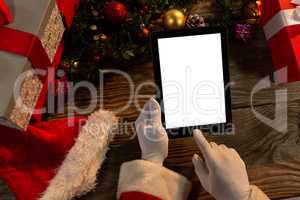 Santa Claus hands using digital tablet