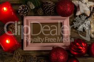 pink wooden frame with Christmas ornament