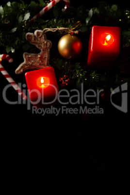 two Christmas red square candles