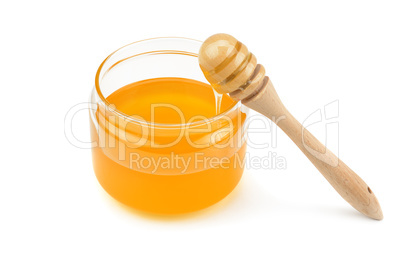 Pot with honey and drizzler isolation on a white background .