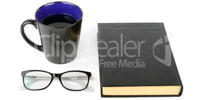 Book, cup with tea and glasses isolated on white background. Wid