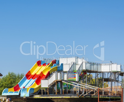 platform with water children's attractions roller coaster stands
