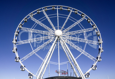 white Ferris wheel with blue background