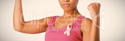 Woman putting up fists for breast cancer awareness