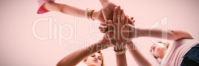 Composite image of woman joining hands for breast cancer awareness