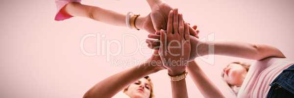 Composite image of woman joining hands for breast cancer awareness