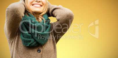 Composite image of  beautiful blond woman with cap and scarf smiling