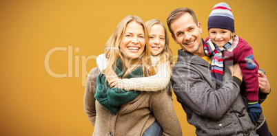 Composite image of portrait of family smiling together