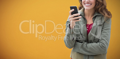 Composite image of image of smiling women interacting with her phone