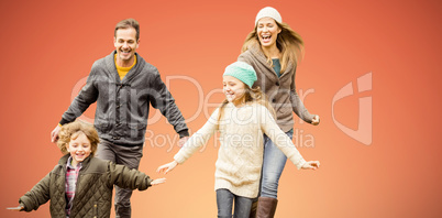 Composite image of cute family is running in a park