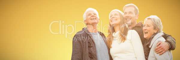 Composite image of senior family laughing