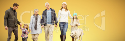 Composite image of happy family walking with their dog