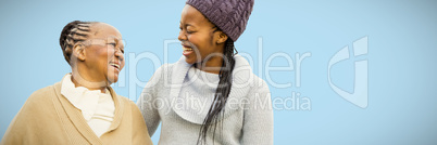 Composite image of mother and grandmother smiling to each other