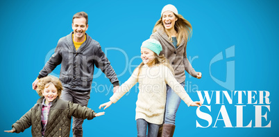 Composite image of cute family is running in a park