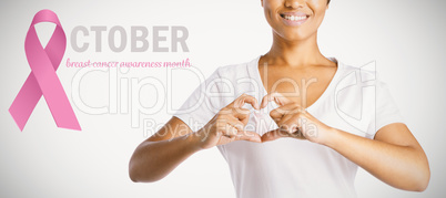 Composite image of pink breast cancer awareness ribbon with text