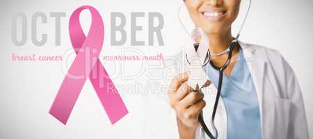 Composite image of text with breast cancer awareness ribbon