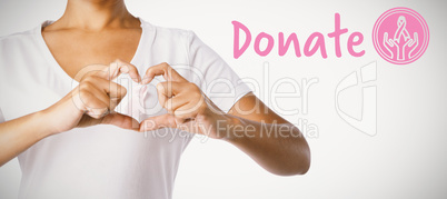 Composite image of graphic image of donate text with breast cancer awareness ribbon