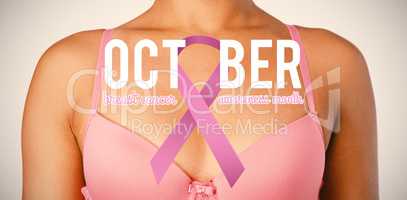 Composite image of breast cancer awareness ribbon with text