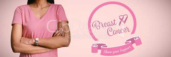 Composite image of women in pink for breast cancer focus on crossed arms