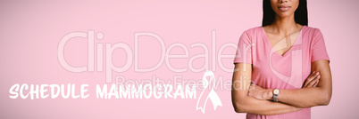 Composite image of  women in pink crossing their arms for breast cancer