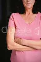 women in pink for breast cancer crosses their arms