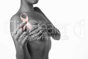 Woman for breast cancer awareness with ribbon