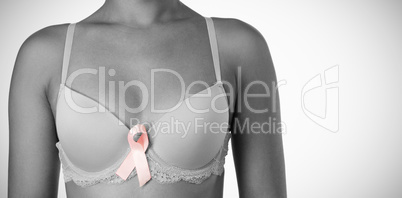 Woman for breast cancer awareness with ribbon