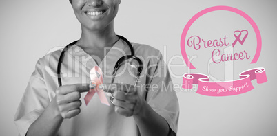 Composite image of heart shape ribbon with breast cancer text