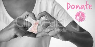 Composite image of graphic image of donate text with breast cancer awareness ribbon