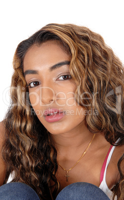 Portrait of serious teen girl with curly long hair