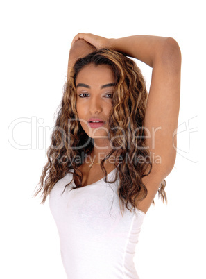 Portrait of serious teen with  her hands over her head