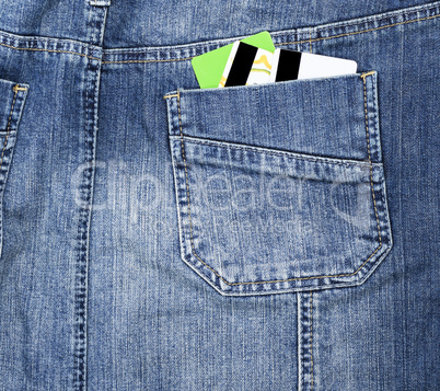 plastic credit card in the back pocket of the jeans