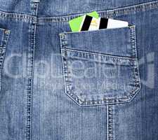 plastic credit card in the back pocket of the jeans