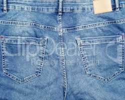 back of blue jeans with pockets