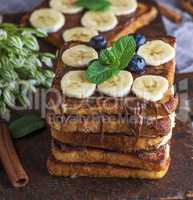 fried chocolate French toasts with pieces of bananas